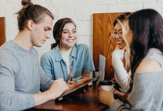 happy people talking in a coffee shop